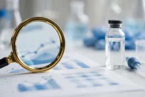 Magnifying glass over a certificate of analysis document